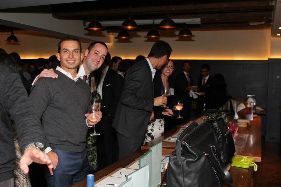 Independent consultants networking with peers at an industry event